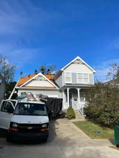 A van parked at the front of the house